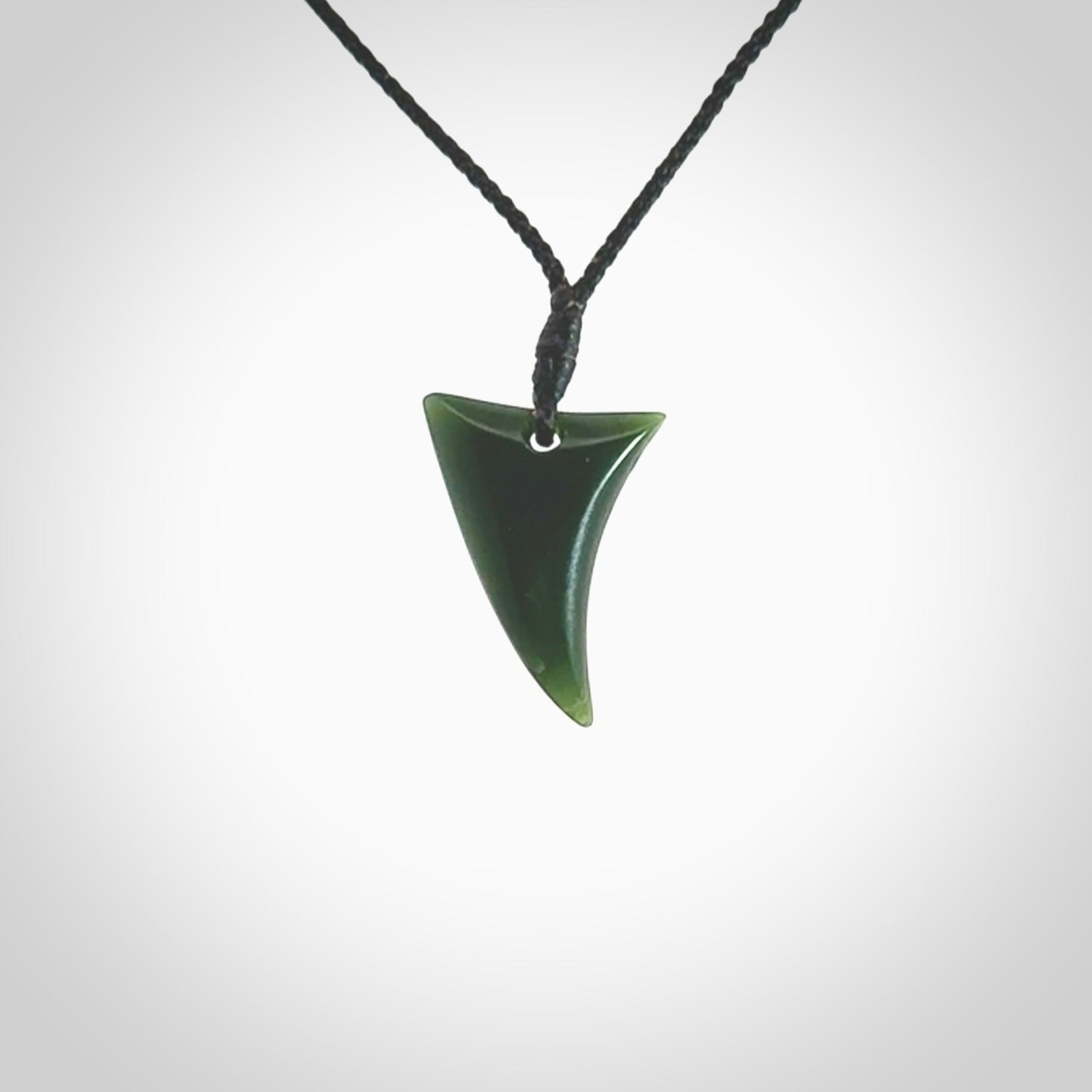 Hand carved pounamu drop pendant. Jade necklace hand made in New Zealand. A contemporary drop pendant carved from rare New Zealand jade. NZ Pacific jade jewellery for sale online.