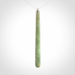 A hand carved New Zealand Jade Drop pendant with sterling silver clasp and chain.