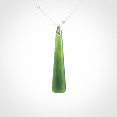 A hand carved New Zealand Jade Drop pendant with sterling silver clasp and chain.