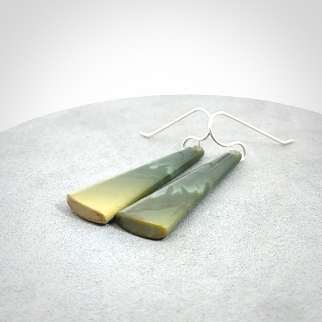 Hand crafted New Zealand Inanga Jade drop earrings with Sterling Silver Hooks. Jade drop earrings, packaged in a woven kete pouch.