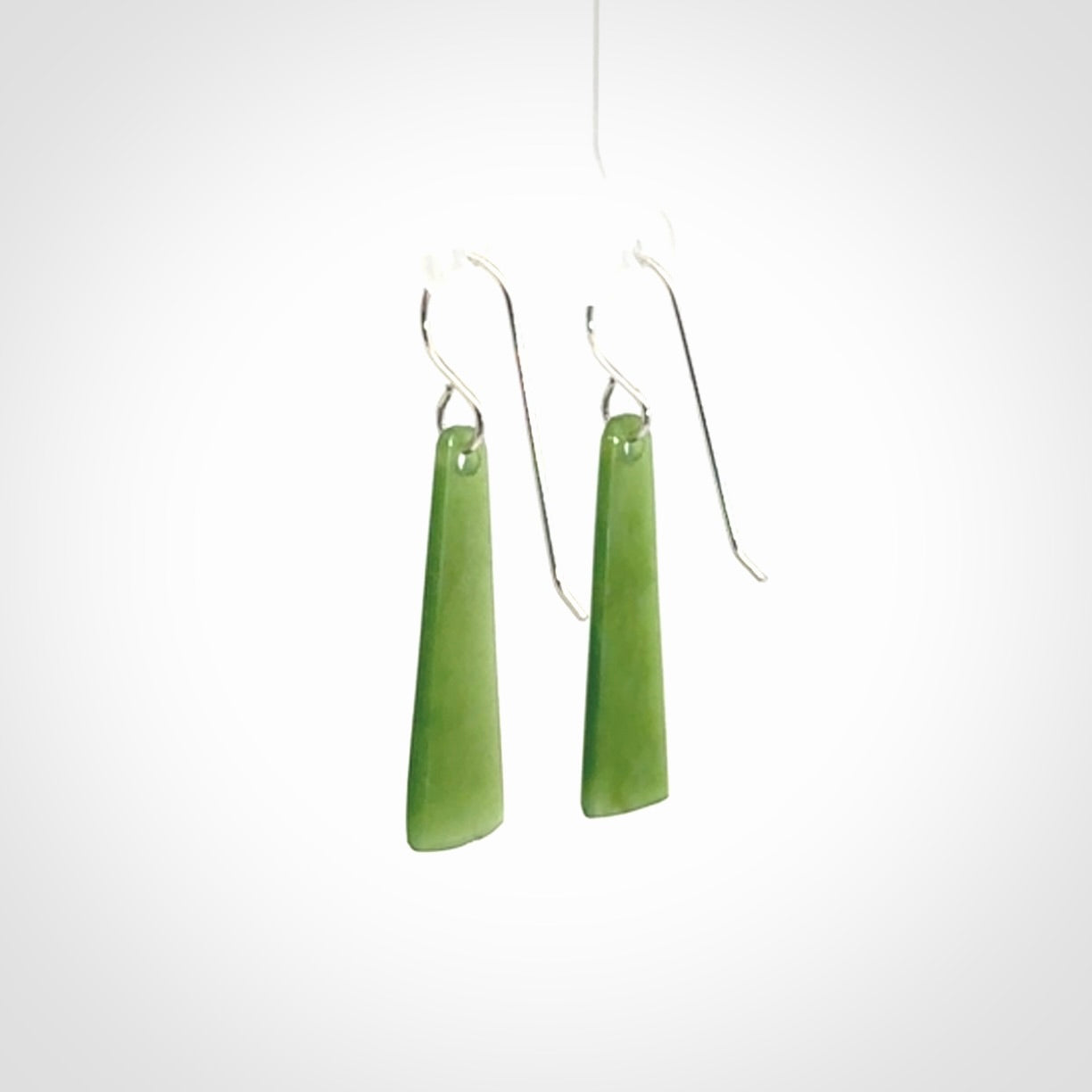 Hand crafted New Zealand Kawakawa Jade drop earrings with Sterling Silver Hooks. Jade drop earrings, packaged in a woven kete pouch.