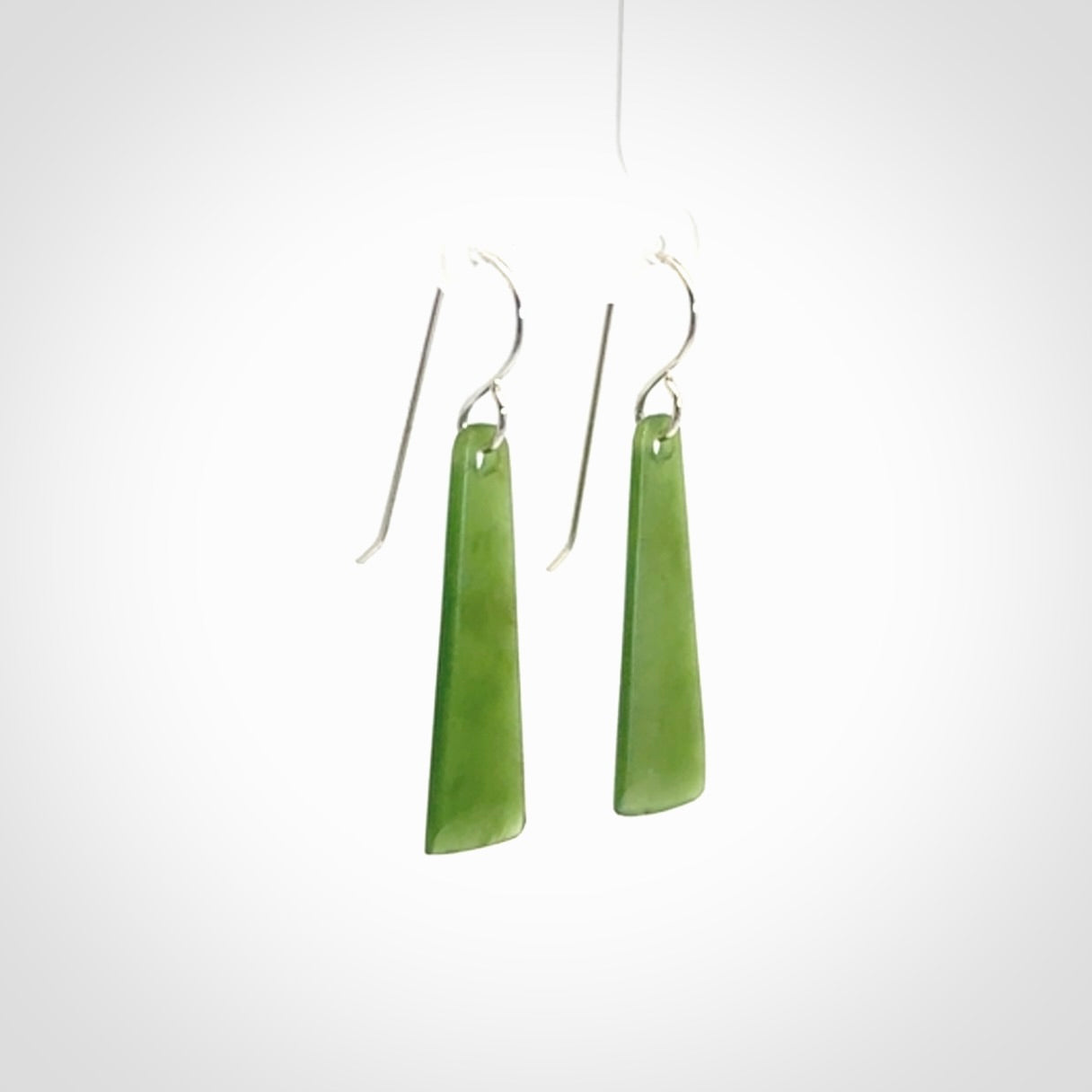 Hand crafted New Zealand Kawakawa Jade drop earrings with Sterling Silver Hooks. Jade drop earrings, packaged in a woven kete pouch.