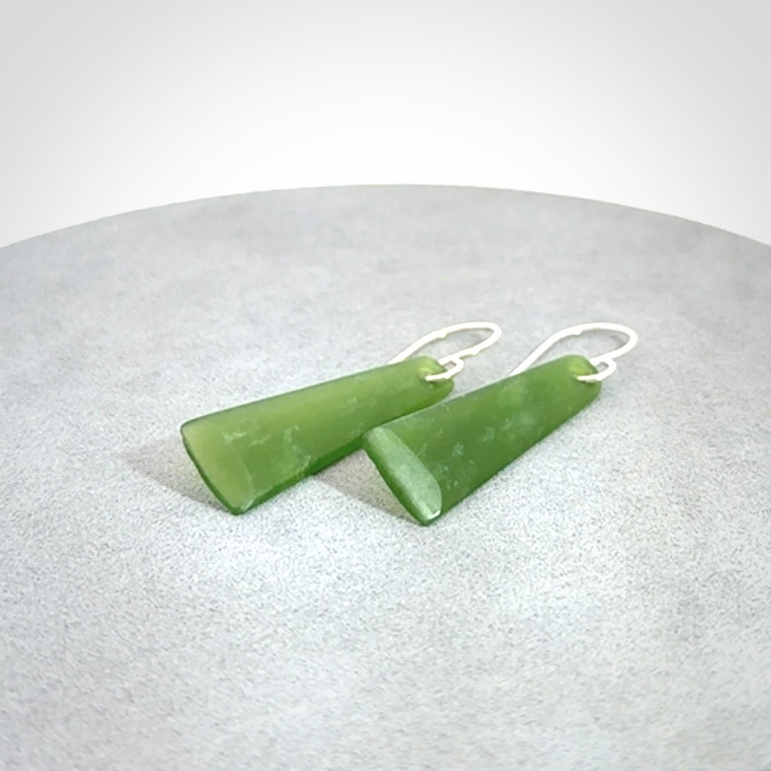 Hand crafted New Zealand Kawakawa Jade drop earrings with Sterling Silver Hooks. Jade drop earrings, packaged in a woven kete pouch.
