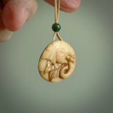 This is a hand carved elephant pendant. It is made from Tigara nut. This is a small sized necklace and is a very unique, one only, pendant that is a collectors piece. Hand carved by New Zealand artist, Sami.