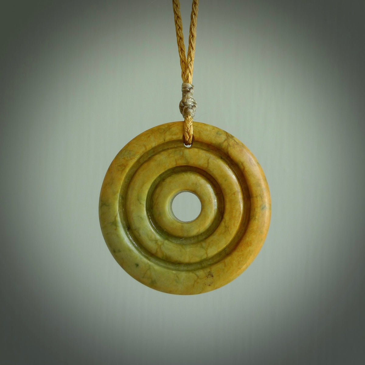 HAND CARVED NEW ZEALAND FLOWER JADE OVAL PENDANT. JADE OVAL NECKLACE