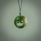 This pendant is a complex koru design. Carved in gorgeous New Zealand jade it is a medium sized pendant that can be worn by anyone. Hand made in New Zealand by NZ Pacific.