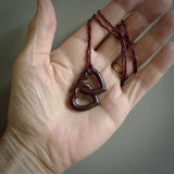 Hand carved double heart pendant made in black jade, green jade and jasper stone. Made by NZ Pacific. Carved from green jade, black jade and red jasper stone. Free delivery worldwide.