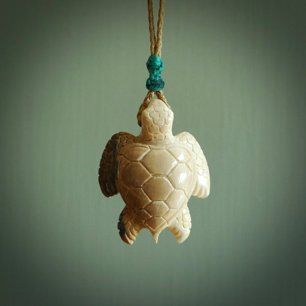 This is a beautiful hand carved woolly mammoth tusk turtle pendant. A really cool piece that is made from this rare and beautiful material. The mammoth has a very distinctive grain and each piece is different. We ship this worldwide and the cost of shipping is included in the price.