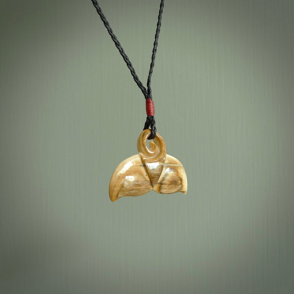 Hand carved whale tail pendant. Carved from woolly mammoth tusk in 10,000 year old mammoth tusk. A rare and original handmade pendant for ocean lovers.