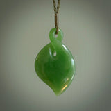 Hand carved New Zealand jade, single twist pendant. Maori pikorua pendant hand carved in New Zealand. Made by NZ Pacific, jade jewellery for sale online. One only hand made by Ross Crump.