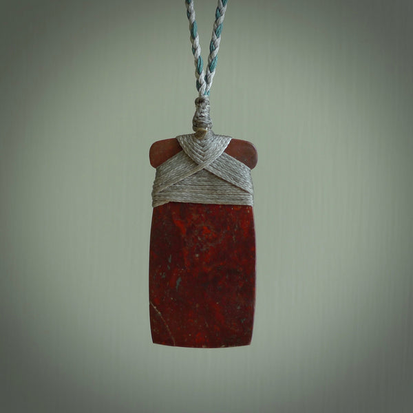 This is a beautiful hand carved Red Jasper Stone toki pendant. A really cool piece that is made from this rare and beautiful material. The red jasper has a very distinctive look and each piece is different. We ship this worldwide and the cost of shipping is included in the price.