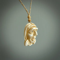 Hand carved incredible stained bone gargoyle face carving. A stunning work of art. This pendant was hand carved in bone with buffalo horn inlay for the eyes by Yuri Terenyi. A one off collectors item that has been hand crafted to be worn or displayed.