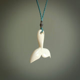 Hand carved bone whale tail pendant. Made by NZ Pacific. Bone whale tail necklace with adjustable cord.