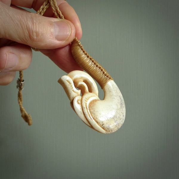 This is a wonderful pendant carved from Deer Antler. Hand made by Anthony Bray-Heta. Order yours now on NZ Pacific at www.nzpacific.com