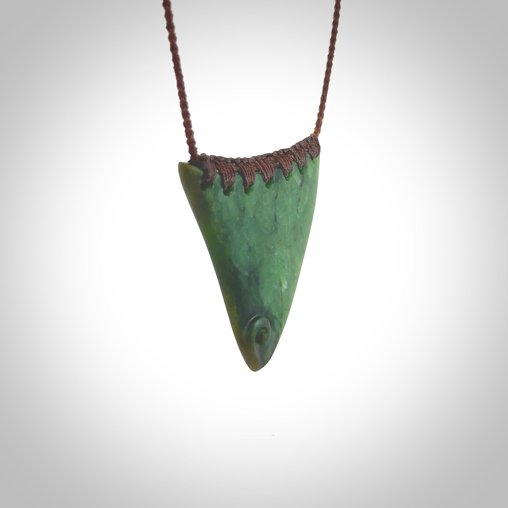 This pendant is a sized niho with koru heart necklace carved from a deep green piece of New Zealand Jade. Kyohei Noguchi carved this piece for us so the workmanship is outstanding. Handmade in New Zealand, a beautiful piece of jade jewellery.
