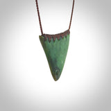 This pendant is a sized niho with koru heart necklace carved from a deep green piece of New Zealand Jade. Kyohei Noguchi carved this piece for us so the workmanship is outstanding. Handmade in New Zealand, a beautiful piece of jade jewellery.