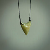 This is a lovely New Zealand Jade, pounamu drop pendant. Hand carved for us by Ric Moor. It is bound with an adjustable black coloured cord which is length adjustable. Free worldwide shipping.