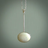 Hand made pendant with one side carved from Woolly mammoth tusk and the other from our local cold water pāua shell. This is a custom design by us and only available fro NZ Pacific.