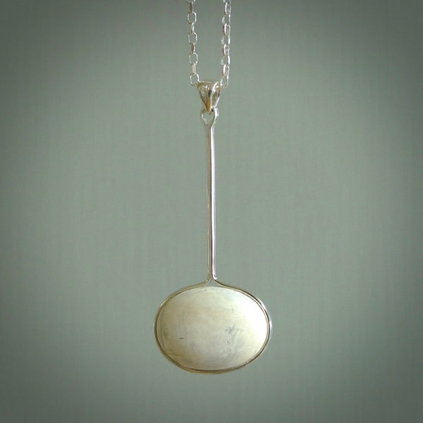 Hand made pendant with one side carved from Woolly mammoth tusk and the other from our local cold water pāua shell. This is a custom design by us and only available fro NZ Pacific.