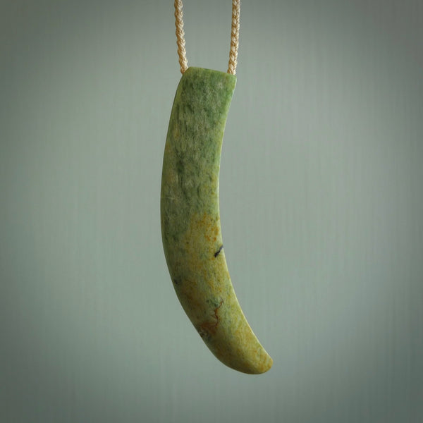 Hand carved pounamu drop pendant. Jade necklace hand made in New Zealand. A contemporary drop pendant carved from rare New Zealand flower jade. NZ Pacific jade jewellery for sale online.