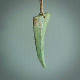 Hand carved pounamu drop pendant. Jade necklace hand made in New Zealand. A contemporary drop pendant carved from rare New Zealand flower jade. NZ Pacific jade jewellery for sale online.