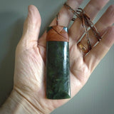 This is a lovely, one-off large, green toki pendant we've made from a gorgeous New Zealand jade. It is finished in a polished sheen and is bound with our plaited cord. These are wonderful pieces that are very attractive and will last a lifetime.