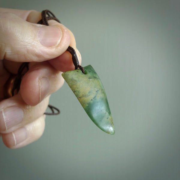 Hand carved jade niho, fang, pendant. Carved by New Zealand artist Ric Moor. Contemporary New Zealand Jade fang, drop necklace. One only unique pendant for men and women.