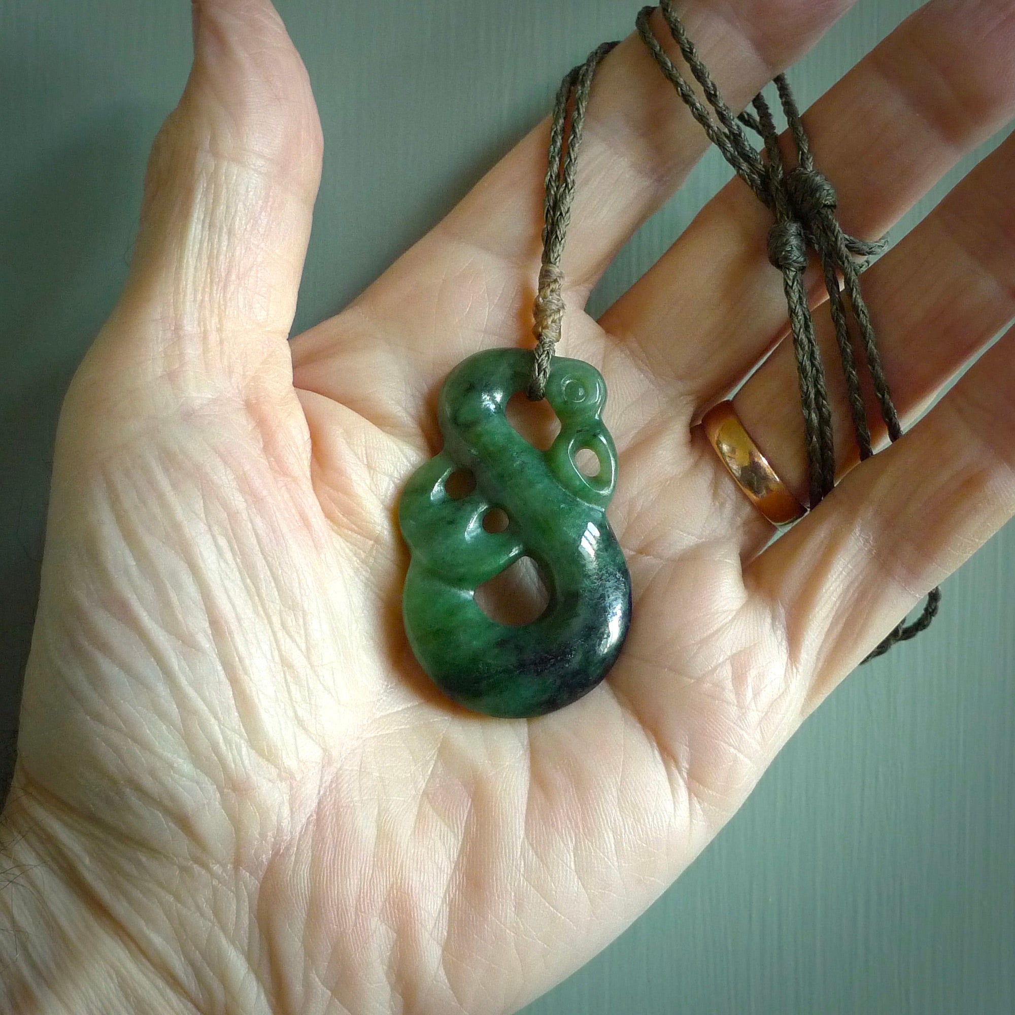 Hand carved New Zealand Jade manaia pendant. Maori pendant hand carved in New Zealand. Ethnic art jewellery. Hand made polished Manaia necklace for men and women.