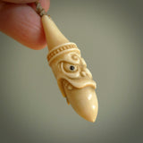 Hand carved incredible stained bone gargoyle face carving. A stunning work of art. This pendant was hand carved in bone with buffalo horn inlay for the eyes by Yuri Terenyi. A one off collectors item that has been hand crafted to be worn or displayed.