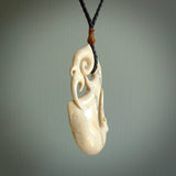 Hand made deer antler manaia pendant. Hand carved by NZ Pacific. Manaia carved from deer antler pendant for sale online. Delivered to you on an adjustable cord.
