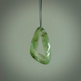 This little piece is a hand carved möbius ribbon pendant. We've carved this from Nephrite Jade from Aceh. It has very subtle colour variations in the stone and is a delightful, small and artistic piece of jewellery.
