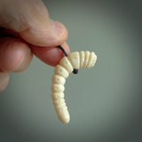 Hand carved huhu bug  pendant, carved for us by Fumio Noguchi. This piece is carved from bone and is a fantastic depiction of these bugs. This particular piece is a huhuh bug design and is lovingly carved. Free shipping worldwide.