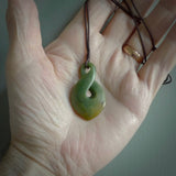Hand carved medium sized, New Zealand jade twist pendant. Carved in New Zealand by NZ Pacific. Māori themed jewellery for sale online.