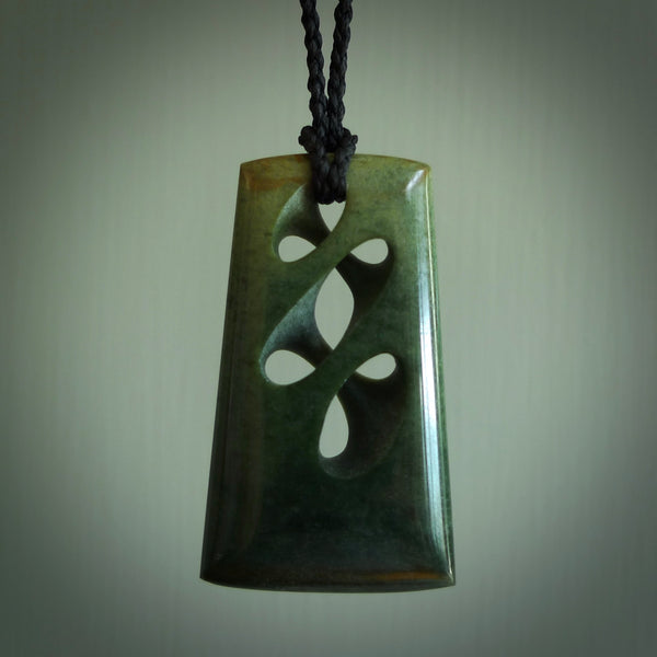 Hand carved New Zealand jade, complex twist pendant. Hand made complex twist pendant hand carved in New Zealand. Made by NZ Pacific, jade jewellery for sale online. One only hand made by Kerry Thompson.