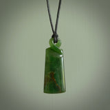 This pendant is a flower jade single twist. It is handcarved from New Zealand flower jade and has a mix of green, mint and pale gold colours interspersed throughout the stone. It has a fine twist, small and light. The cord is hand plaited and can be adjusted. The cord colour on this piece is Khaki. Two sizes available.