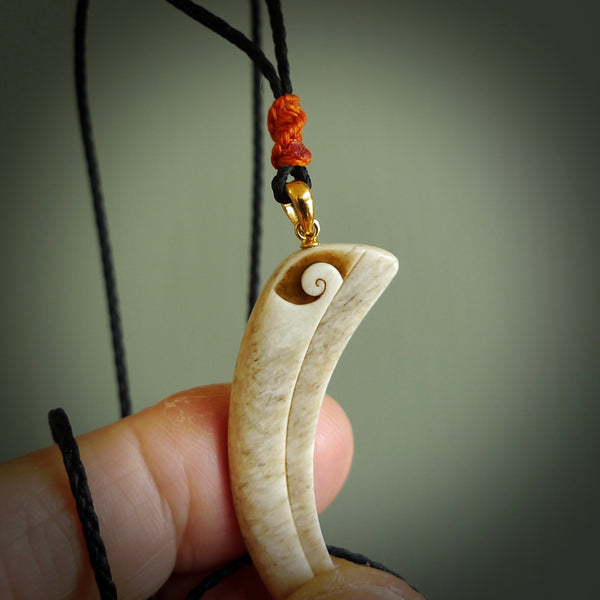 This is a hand carved whale bone huia bird beak pendant. It is made from whale bone with jade bead. This is a large sized necklace and is a very unique, one only, pendant that is a collectors piece. Hand carved by New Zealand artist, Sami.
