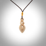Hand carved woolly mammoth tusk twist pendant. Hand made jewellery made by NZ Pacific and for sale online. South Pacific jewellery.