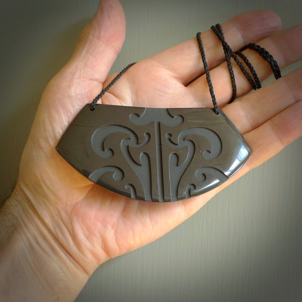 This is a unique breastplate, hand carved from argillite stone by Kerry Thompson. The cord is Black and is adjustable. Free worldwide delivery. One only, large pendant.