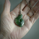 Hand carved medium sized, New Zealand jade twist pendant. Carved in New Zealand by NZ Pacific. Māori themed jewellery for sale online.