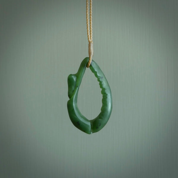 Hand carved contemporary jade broken sea shell jewellery. Made by Donna Summers for NZ Pacific from New Zealand greenstone. Authentic jade jewellery for sale online. These are a beautiful and feminine necklace and would make the perfect gift for the women in your life.