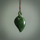 Hand carved New Zealand jade, single twist pendant. Maori pikorua pendant hand carved in New Zealand. Made by NZ Pacific, jade jewellery for sale online. One only hand made by Ross Crump.
