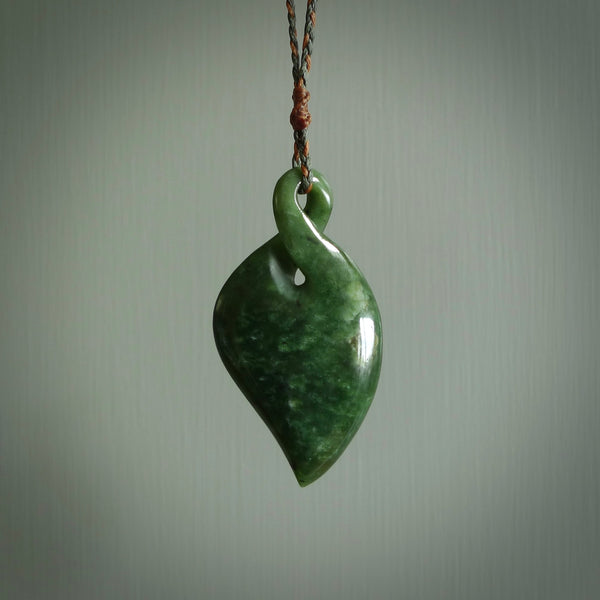 Hand carved New Zealand jade, single twist pendant. Maori pikorua pendant hand carved in New Zealand. Made by NZ Pacific, jade jewellery for sale online. One only hand made by Ross Crump.