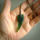 This is a lovely large New Zealand Jade, pounamu drop pendant. Hand carved for us by Ric Moor. It is bound with an adjustable khaki coloured cord which is length adjustable. Free worldwide shipping.