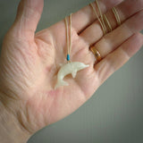 This is a gorgeous little dolphin pendant carved in jadeite. The cord is fine, hand-plaited and length adjustable so you can position the little jade dolphin where it suits you best. Shipping is free worldwide.