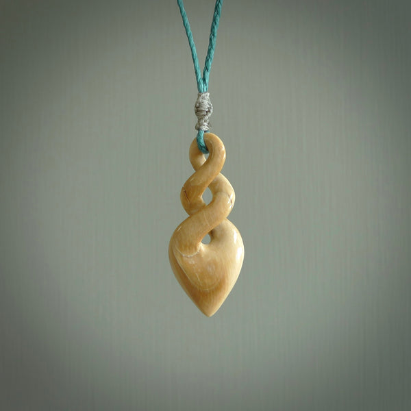 Hand carved woolly mammoth ivory twist pendant. Made by NZ Pacific.