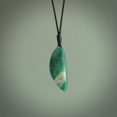 This is a handcrafted aotea stone drop pendant. This is a solid little work of art. We ship this worldwide for free and are happy to answer any questions that you may have about these or other products on our website.