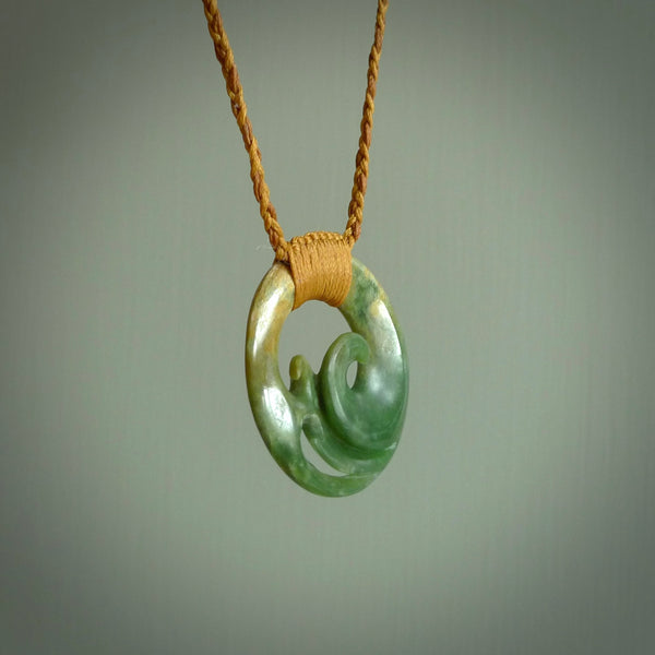 This pendant is a complex koru design. Carved in gorgeous New Zealand jade it is a medium sized pendant that can be worn by anyone. Hand made in New Zealand by NZ Pacific.