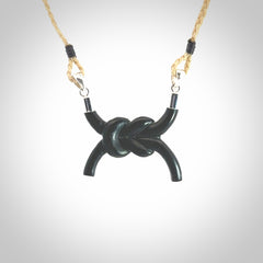 A gorgeous hand carved black jade reef knot pendant with sterling silver. Hand made in Black Jade with Sterling Silver and provided with adjustable cord.