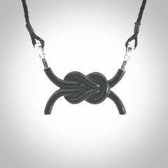 A gorgeous hand carved black jade reef knot pendant with sterling silver. Hand made in Black Jade with Sterling Silver and provided with adjustable cord.