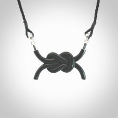 A gorgeous hand carved black jade reef knot pendant with sterling silver. Hand made in Black Jade with Sterling Silver and provided with adjustable cord.